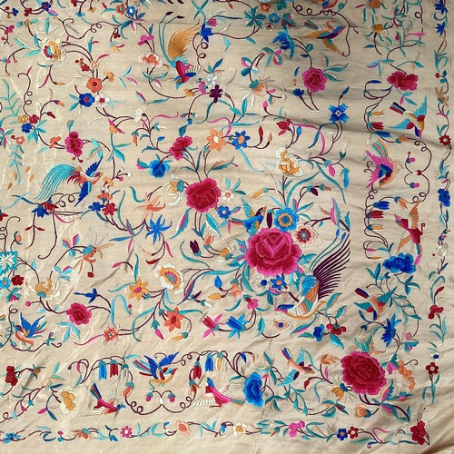 156 - Three throws to include a silk tassled throw in orange with all over pattern of birds of paradise an... 