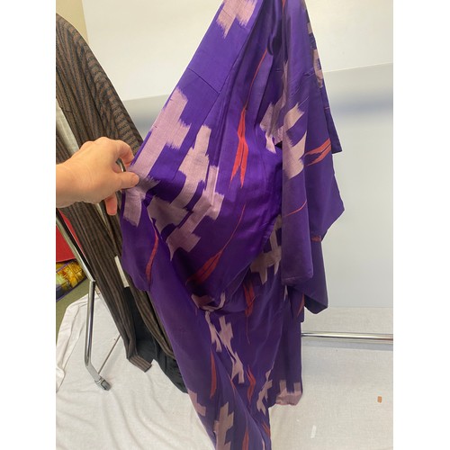 238 - 2 1960s kimonos , a purple silk with pale lilac graphic pattern, lined in printed cotton, and a brow... 