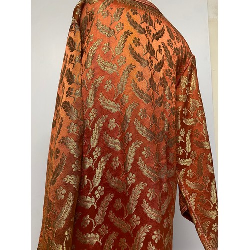 228 - A orange silk and gold coloured thread Kaftan, purchased in Marrakech in 1964, condition, some minor... 