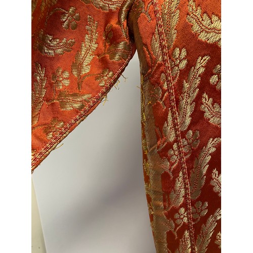 228 - A orange silk and gold coloured thread Kaftan, purchased in Marrakech in 1964, condition, some minor... 