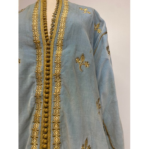 226 - A blue velvet antique wedding Kaftan, embroidered in gold coloured thread, and purchased in Marrakec... 