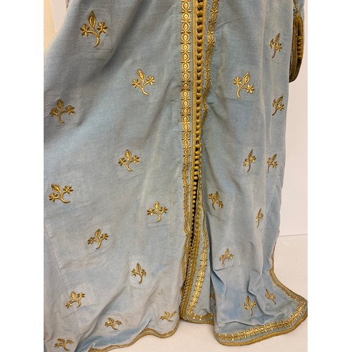 226 - A blue velvet antique wedding Kaftan, embroidered in gold coloured thread, and purchased in Marrakec... 