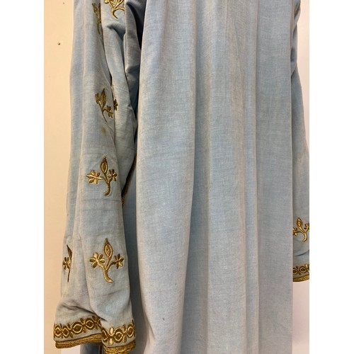 226 - A blue velvet antique wedding Kaftan, embroidered in gold coloured thread, and purchased in Marrakec... 