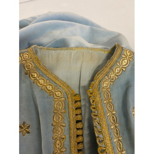 226 - A blue velvet antique wedding Kaftan, embroidered in gold coloured thread, and purchased in Marrakec... 