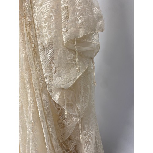 225 - A bespoke lace wedding dress/kaftan, designed and made by Thea Porter, 1978