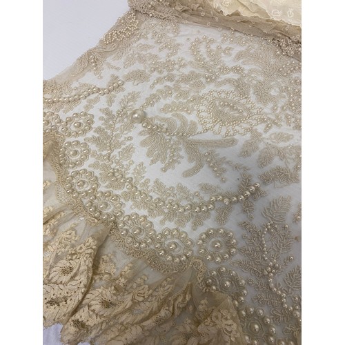 169 - A quantity of antique and later lace, one piece with pearl coloured bead work, as found with some we... 