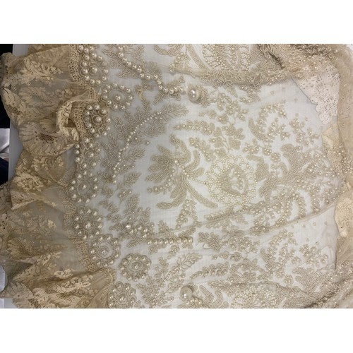 169 - A quantity of antique and later lace, one piece with pearl coloured bead work, as found with some we... 