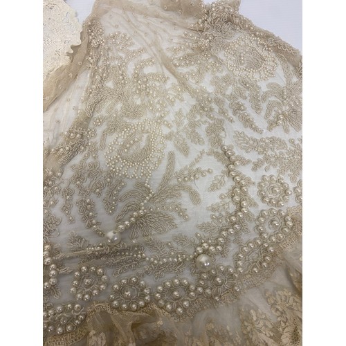 169 - A quantity of antique and later lace, one piece with pearl coloured bead work, as found with some we... 