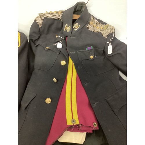 197 - A collection of military uniforms relating to the Royal Hussars to include epaulettes badges etc.