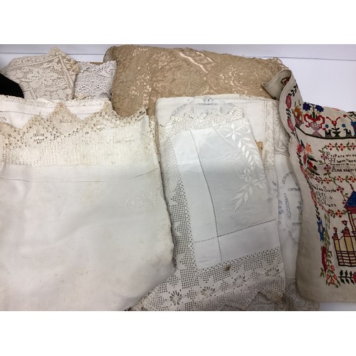 157 - A quantity of  various textiles to include lace, samplers, linen, embroidered hankies,  table cloths... 