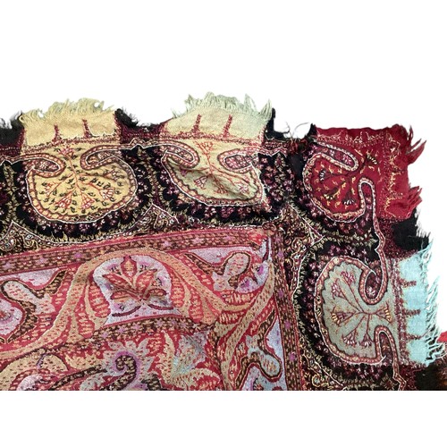 153 - Two embroidered/woven textile Paisley throws, some damage and repairs , one in muted browns and reds... 