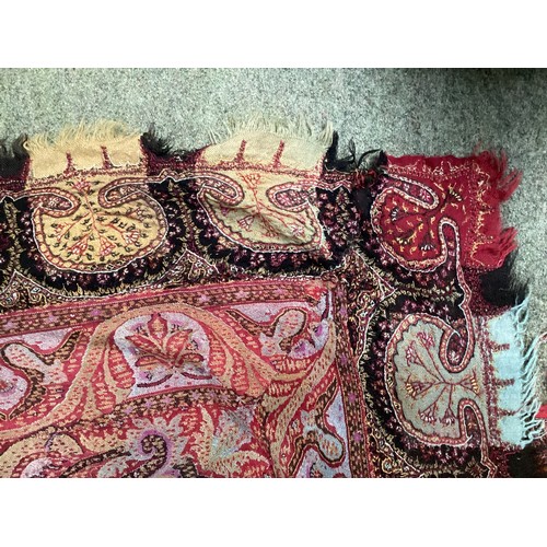 153 - Two embroidered/woven textile Paisley throws, some damage and repairs , one in muted browns and reds... 