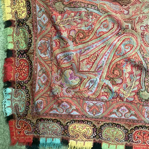 153 - Two embroidered/woven textile Paisley throws, some damage and repairs , one in muted browns and reds... 