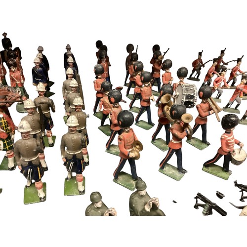 348 - A large collection of Britains and earlier hand painted lead toy soldiers, see all images. Some cond... 