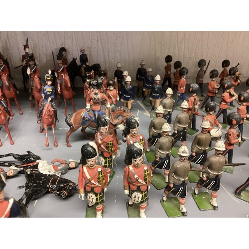 348 - A large collection of Britains and earlier hand painted lead toy soldiers, see all images. Some cond... 