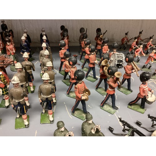 348 - A large collection of Britains and earlier hand painted lead toy soldiers, see all images. Some cond... 