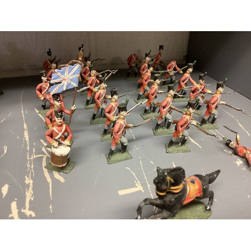 348 - A large collection of Britains and earlier hand painted lead toy soldiers, see all images. Some cond... 