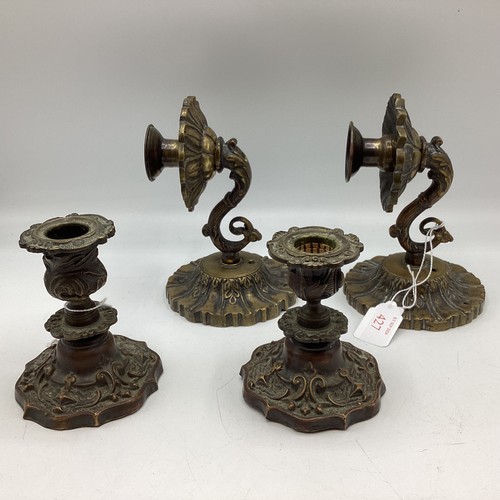 427 - A a pair of brass sconces and a pair of brass candlesticks