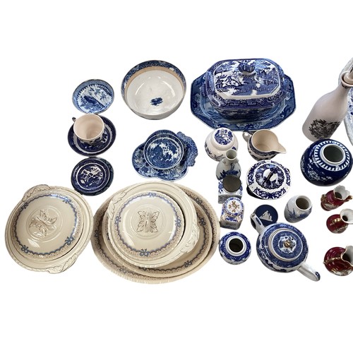 334 - A mixed collection of china to include a blue and white meat platters tureens , and other items.