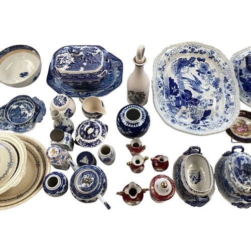 334 - A mixed collection of china to include a blue and white meat platters tureens , and other items.