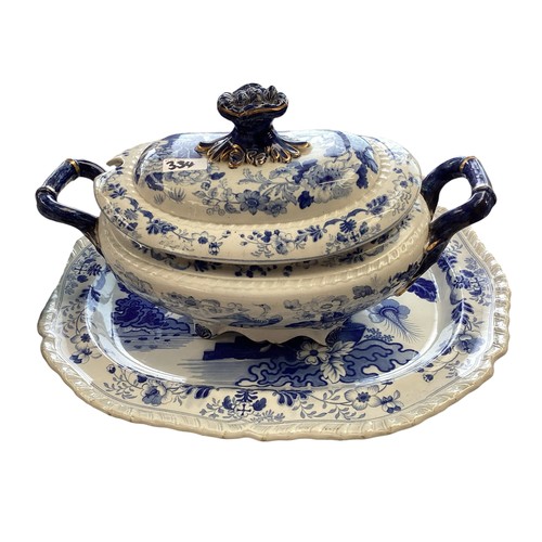 334 - A mixed collection of china to include a blue and white meat platters tureens , and other items.