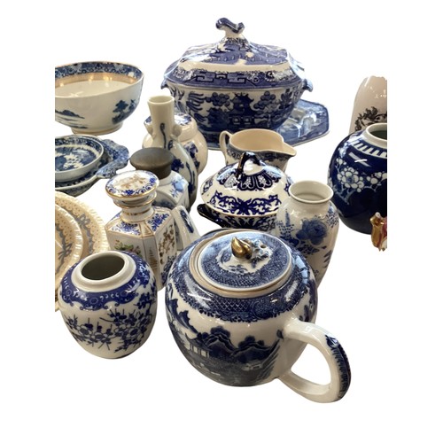 334 - A mixed collection of china to include a blue and white meat platters tureens , and other items.