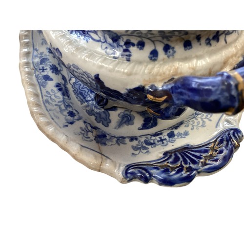 334 - A mixed collection of china to include a blue and white meat platters tureens , and other items.