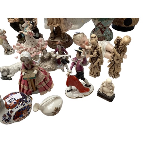 333 - A mixed collection of china to include  a pair of Staffordshire flat back spaniels , figurines vases... 