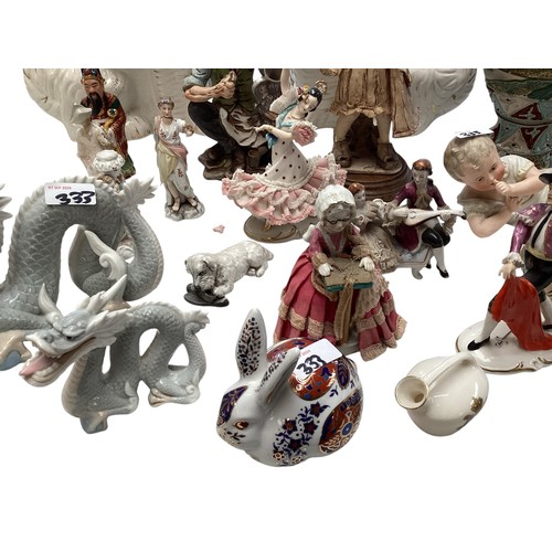 333 - A mixed collection of china to include  a pair of Staffordshire flat back spaniels , figurines vases... 