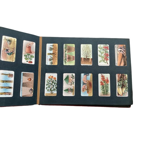 330 - A collection of cigarette cards and 20th century UK coinage.