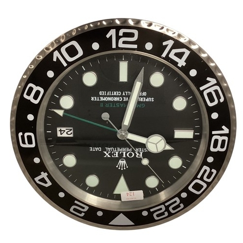 124 - A Rolex Oyster perpetual GMT Master II wall clock. 34cm