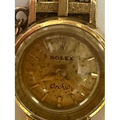 143 - A 18ct gold Rolex Orchid cocktail watch with integral 18ct gold strap(Gross 24.6g) together with a y... 