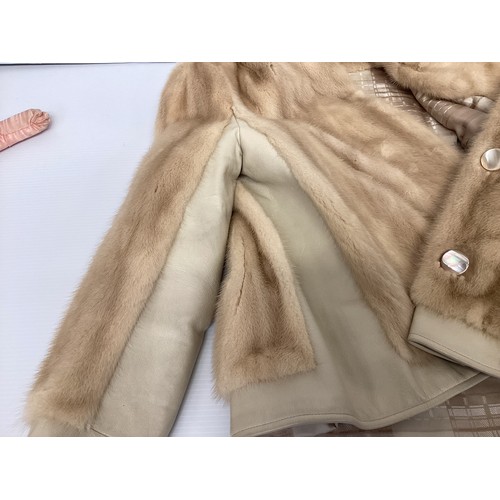 302 - A ladies cream leather and fur bomber jacket Gerhardt Kansas City label (wear to the lining); a thre... 