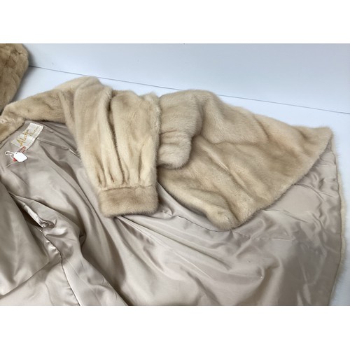 302 - A ladies cream leather and fur bomber jacket Gerhardt Kansas City label (wear to the lining); a thre... 