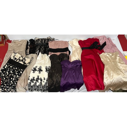 313 - A quantity of dresses 29, strapless/prom/ball/party dresses. Some worn, some never worn.