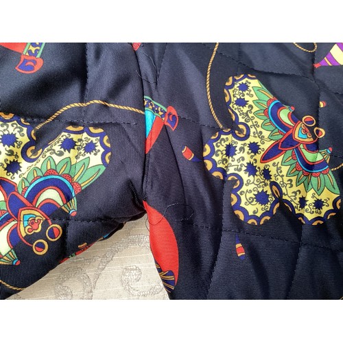 297 - A vintage Hermes, Paris, silk quilted jacket, limited edition, with brightly coloured design.