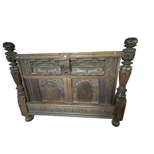 679 - A large carved headboard.