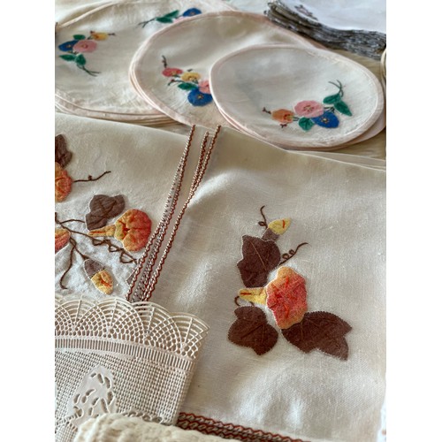 264 - A quantity of vintage accessories and linen, to include a quantity of embroidered and laced table ma... 