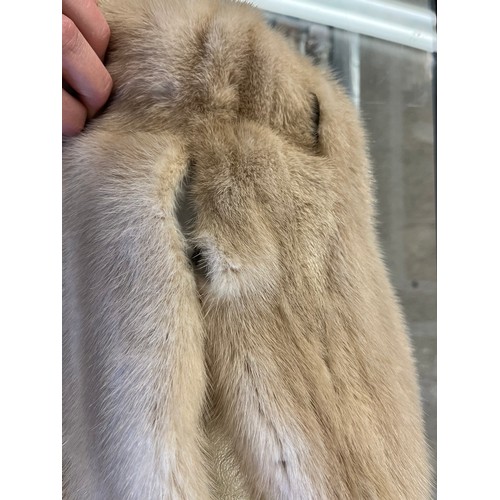 302 - A ladies cream leather and fur bomber jacket Gerhardt Kansas City label (wear to the lining); a thre... 