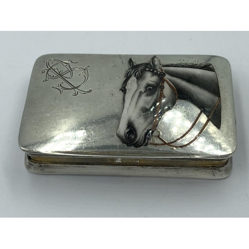 54 - A Continental 800S marked silver snuff box with gilt interior and enamelled horse head decoration to... 