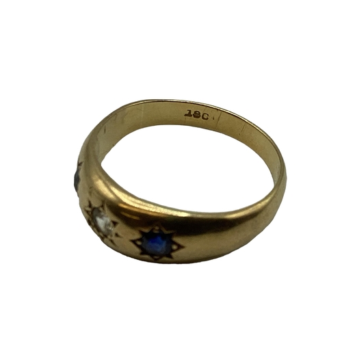 66 - An 18ct gold sapphire and diamond Gypsy ring. With star set diamond and sapphire accents. Size O. 3.... 