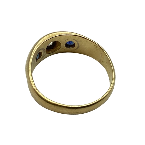 66 - An 18ct gold sapphire and diamond Gypsy ring. With star set diamond and sapphire accents. Size O. 3.... 