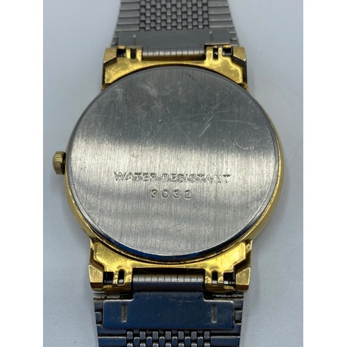 65 - Rotary wrist watch with metal strap