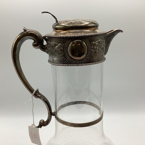 27 - A large Victorian sterling silver mounted claret jug. Walter and Charles Sissons, Sheffield. 1866. 3... 