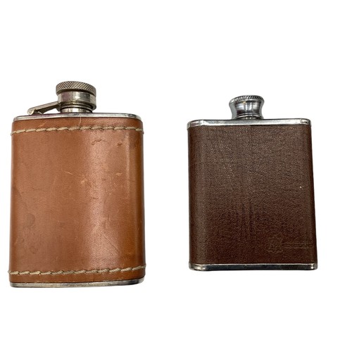 21 - A collection of hip and hunting flasks to include a sterling silver and snake skin example. Sheffiel... 