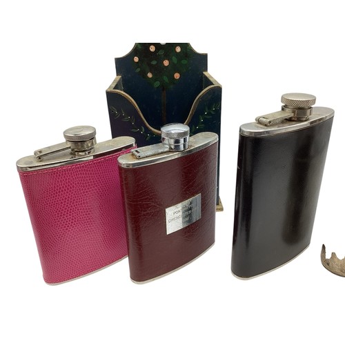 21 - A collection of hip and hunting flasks to include a sterling silver and snake skin example. Sheffiel... 