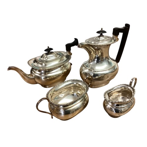 19 - A collection of silver plated wares to include a set of four sweet meat dishes, two tea sets and a l... 