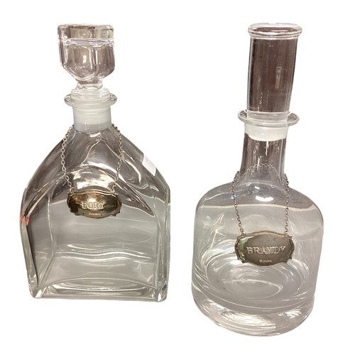 13 - Two glass decanters with sterling silver labels and silver plated items.