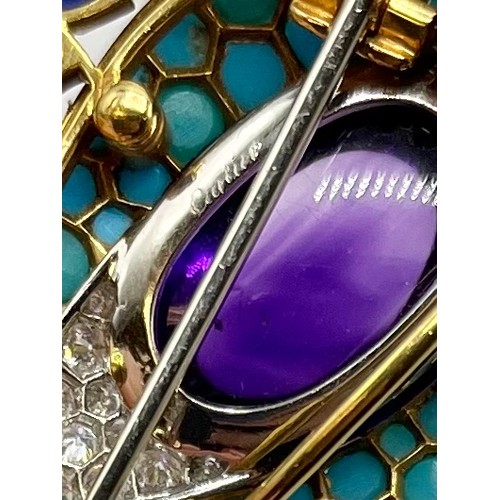 1 - Cartier. A Cartier eye brooch, enamel turquoise amethyst and diamond to a yellow and white metal mou... 