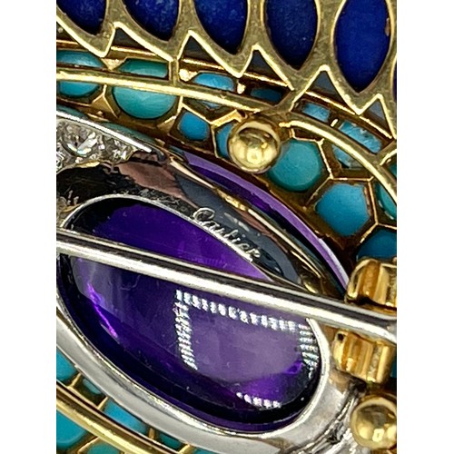 1 - Cartier. A Cartier eye brooch, enamel turquoise amethyst and diamond to a yellow and white metal mou... 